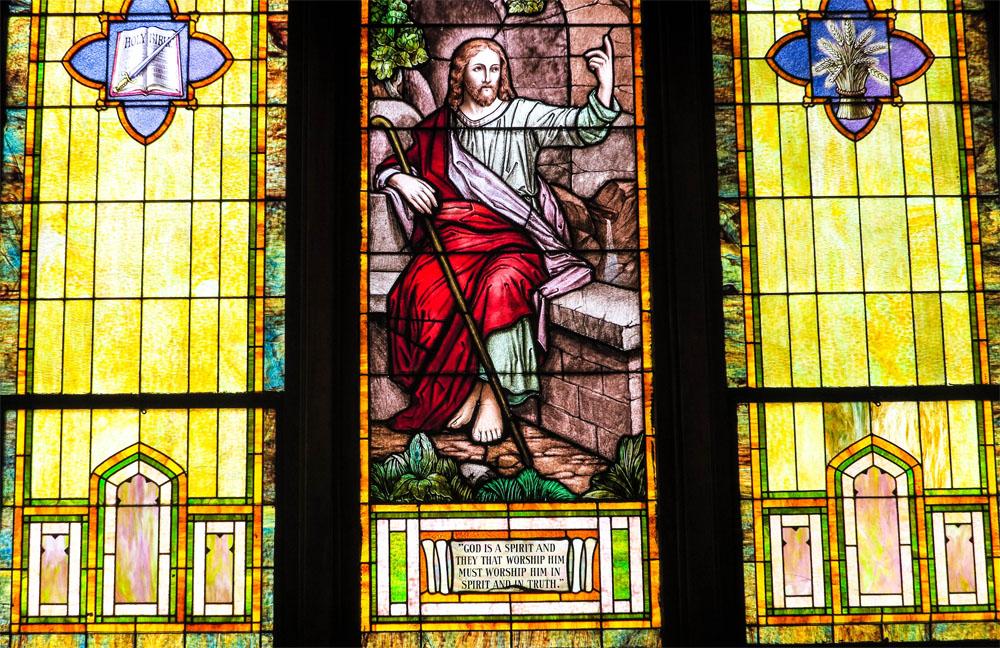 A third stained glass window, showing another biblical story.